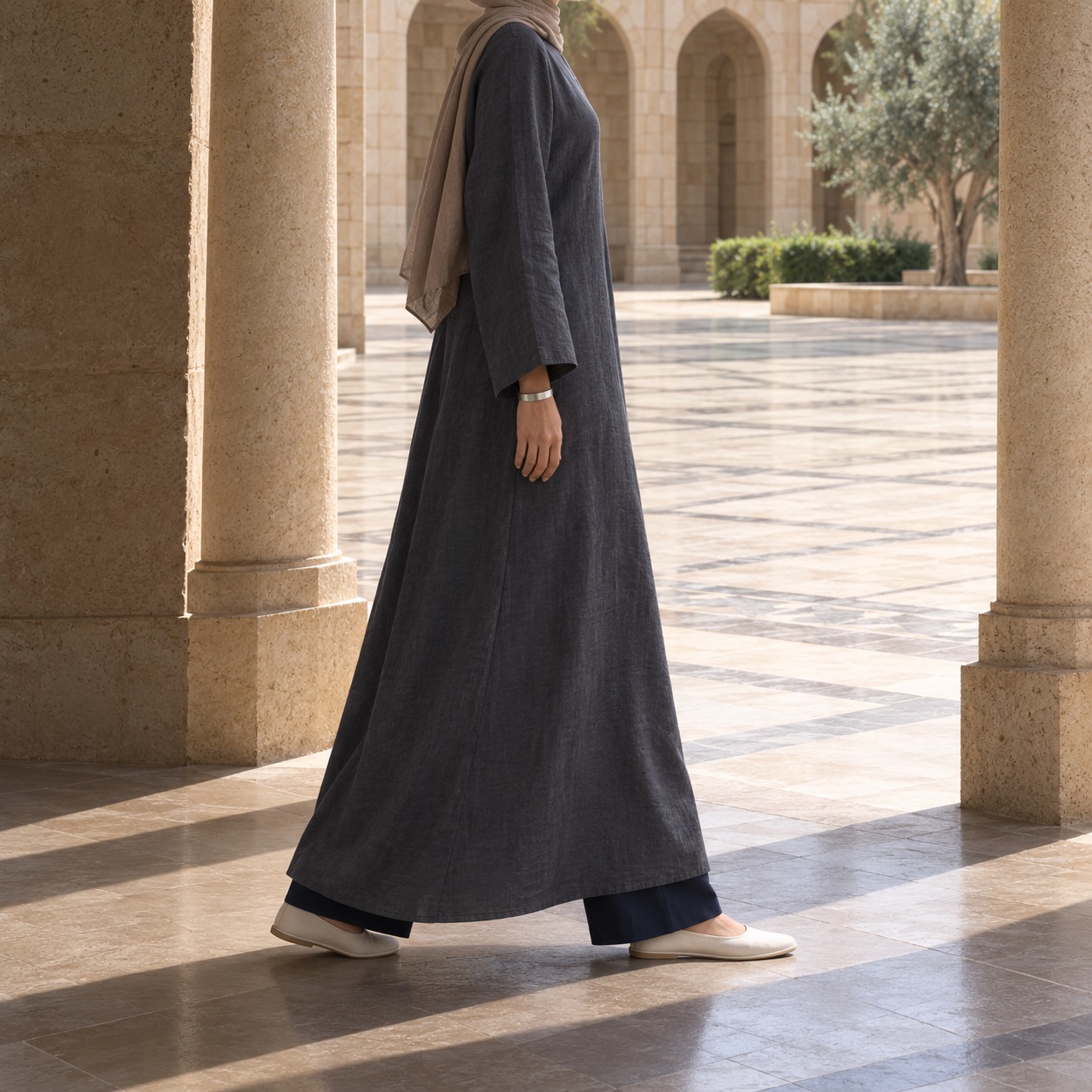 Nettlebed closed abaya — Abayas & Robes by RUQYAH. worn by a model, side view.
