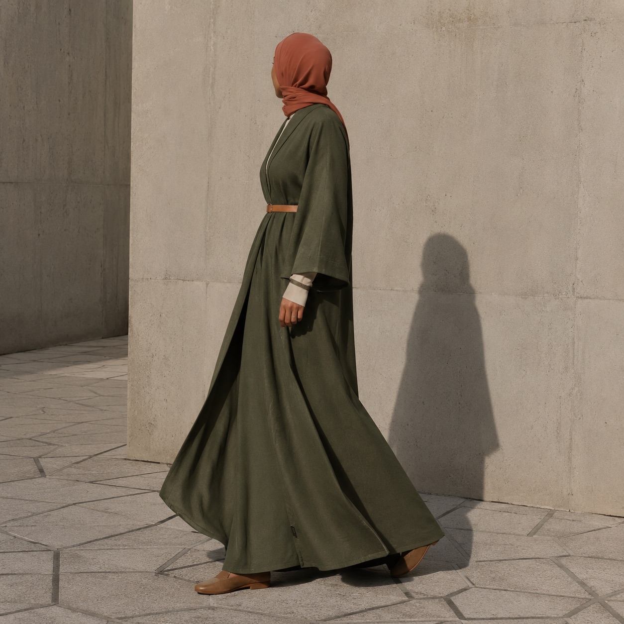 Wyndale open-front abaya — Abayas & Robes by RUQYAH. worn by a model, side view.