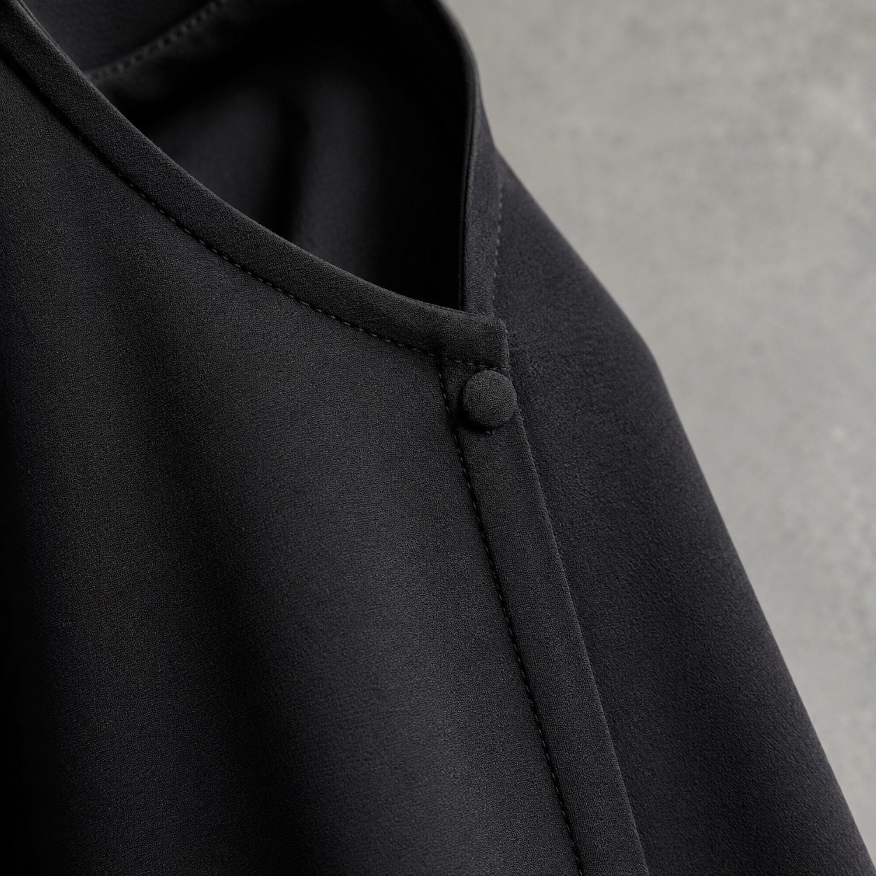 Granta open-front abaya — Abayas & Robes by RUQYAH. close detail of the fabric and finish.