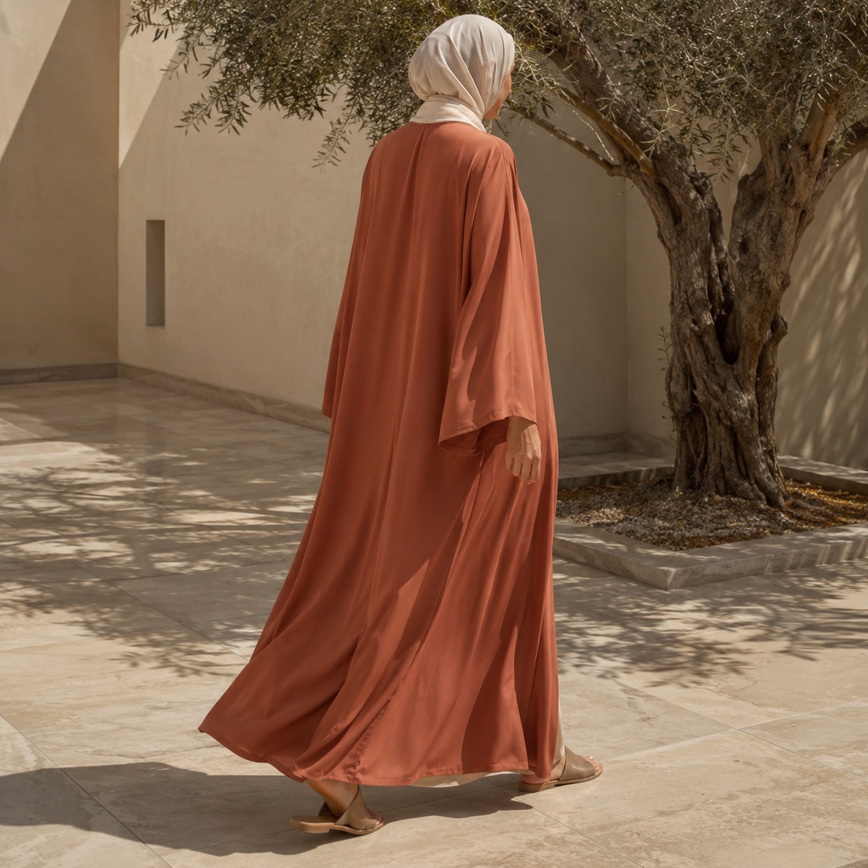 Granta open-front abaya — Abayas & Robes by RUQYAH. worn by a model.