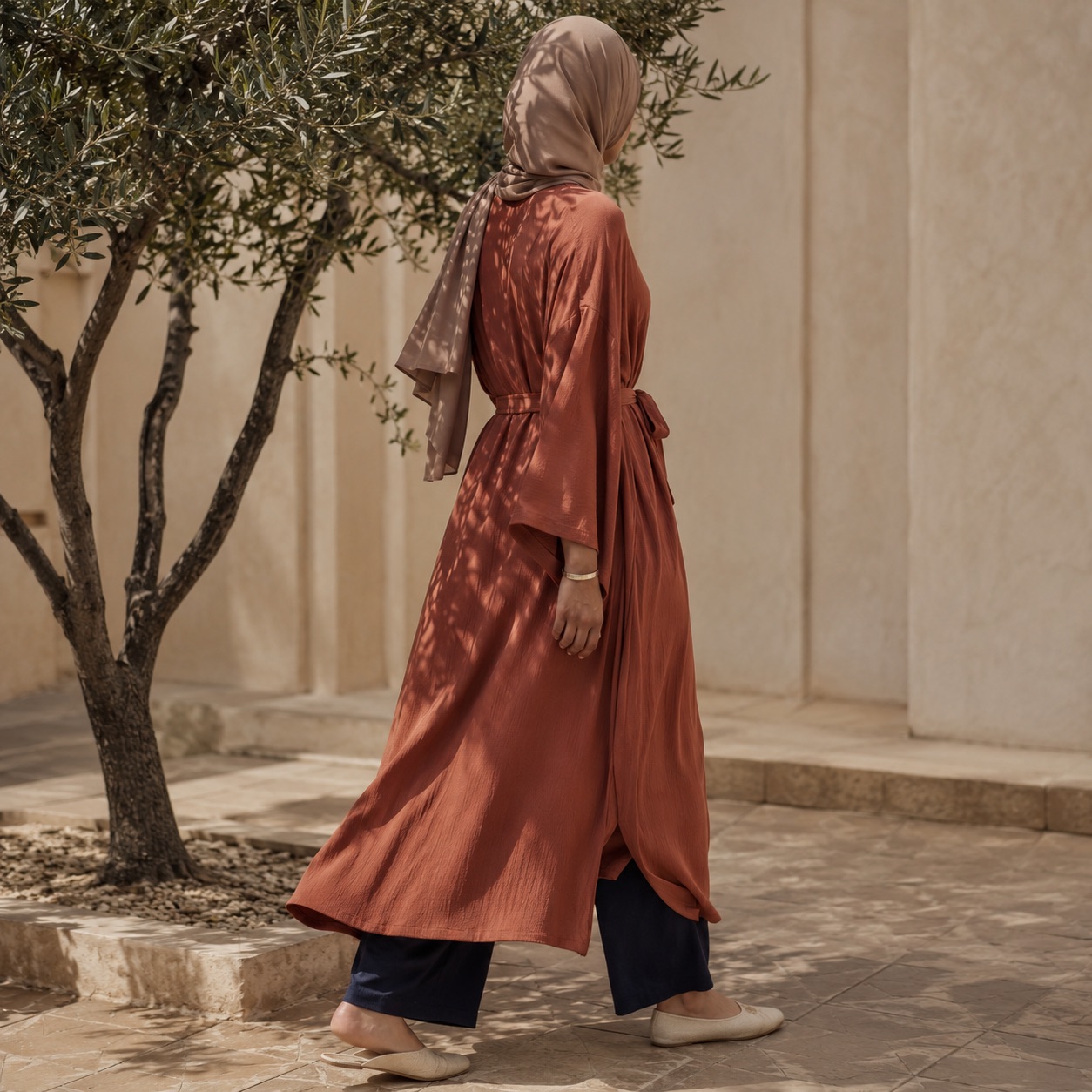 Holloway belted robe — Abayas & Robes by RUQYAH. worn by a model, side view.
