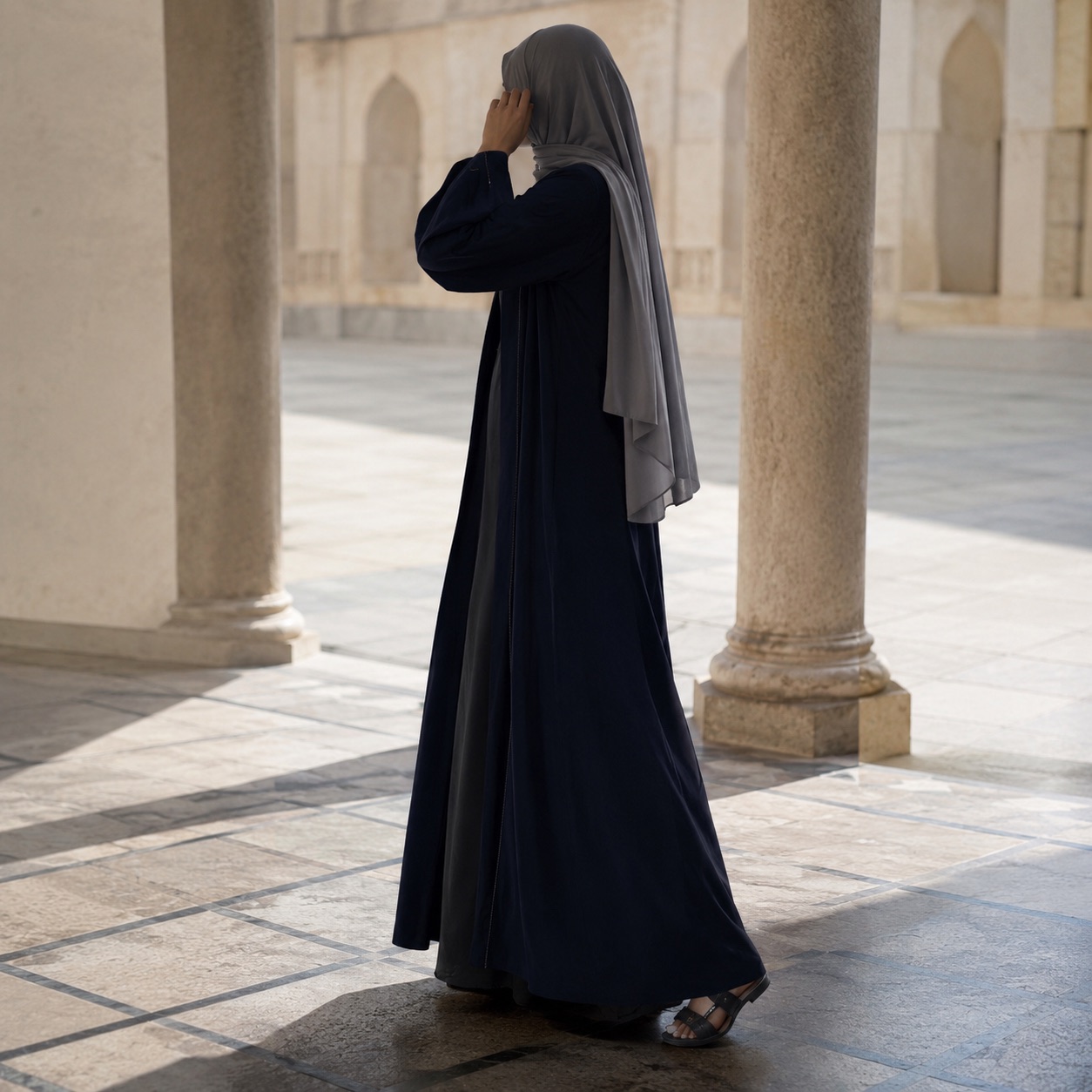 Fenwick open-front abaya — Abayas & Robes by RUQYAH. worn by a model, side view.