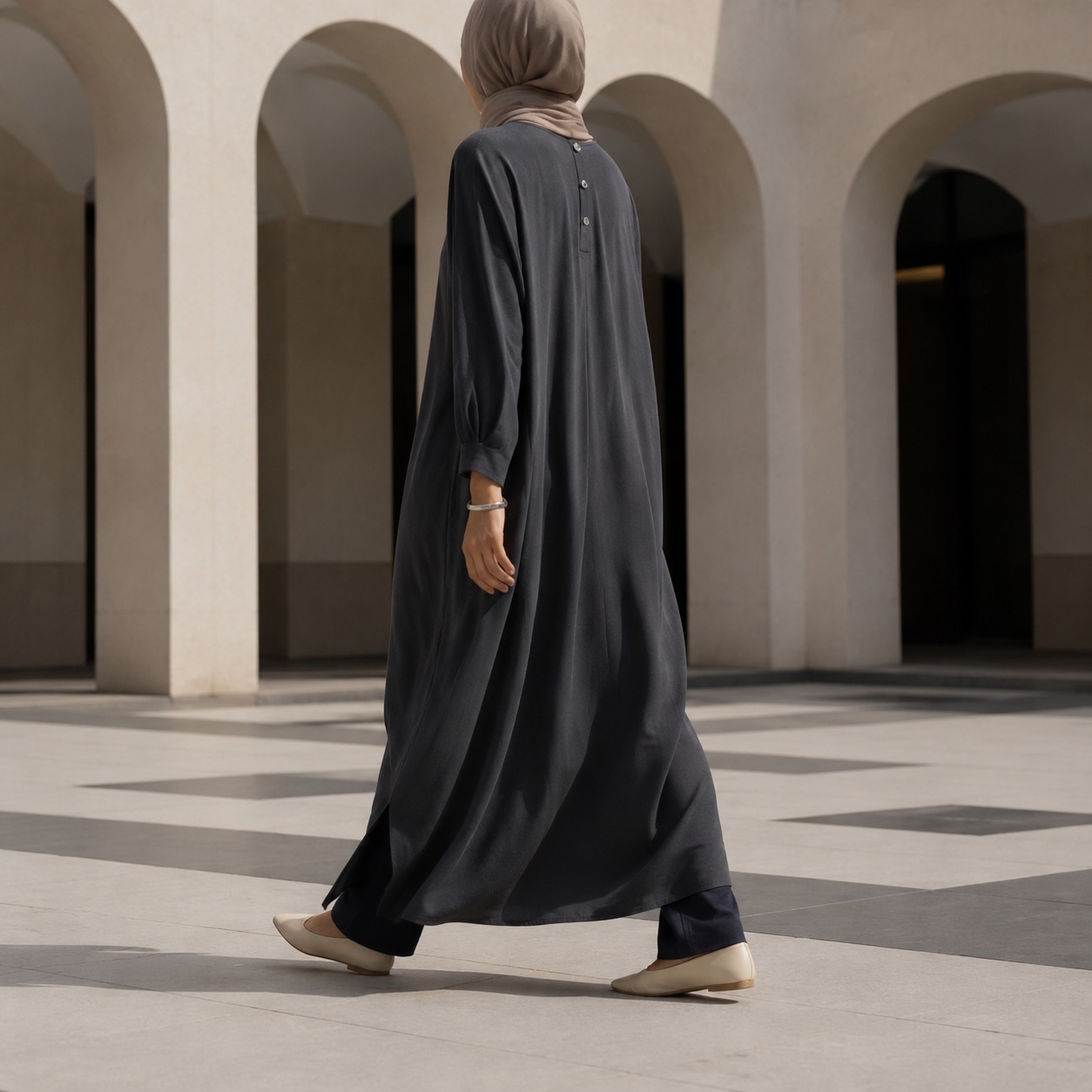 Holloway column dress — Long Dresses by RUQYAH. worn by a model, side view.