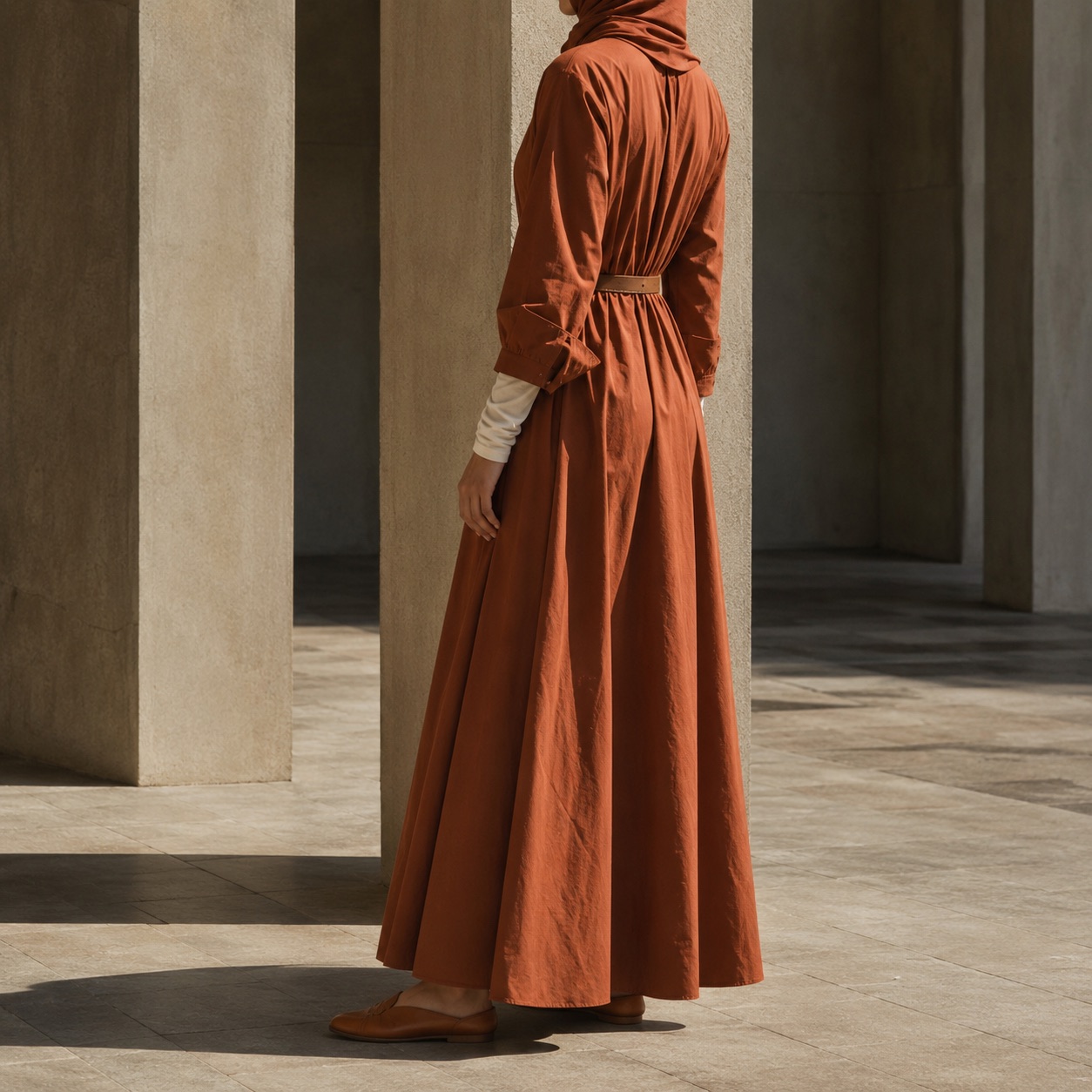 Marlow longline tunic — Tunics & Overtops by RUQYAH. worn by a model, side view.
