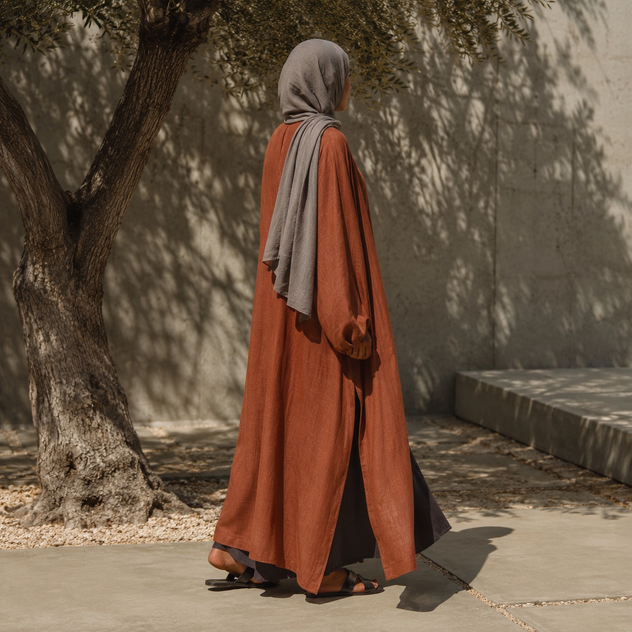Ilkley longline tunic — Tunics & Overtops by RUQYAH. worn by a model, side view.