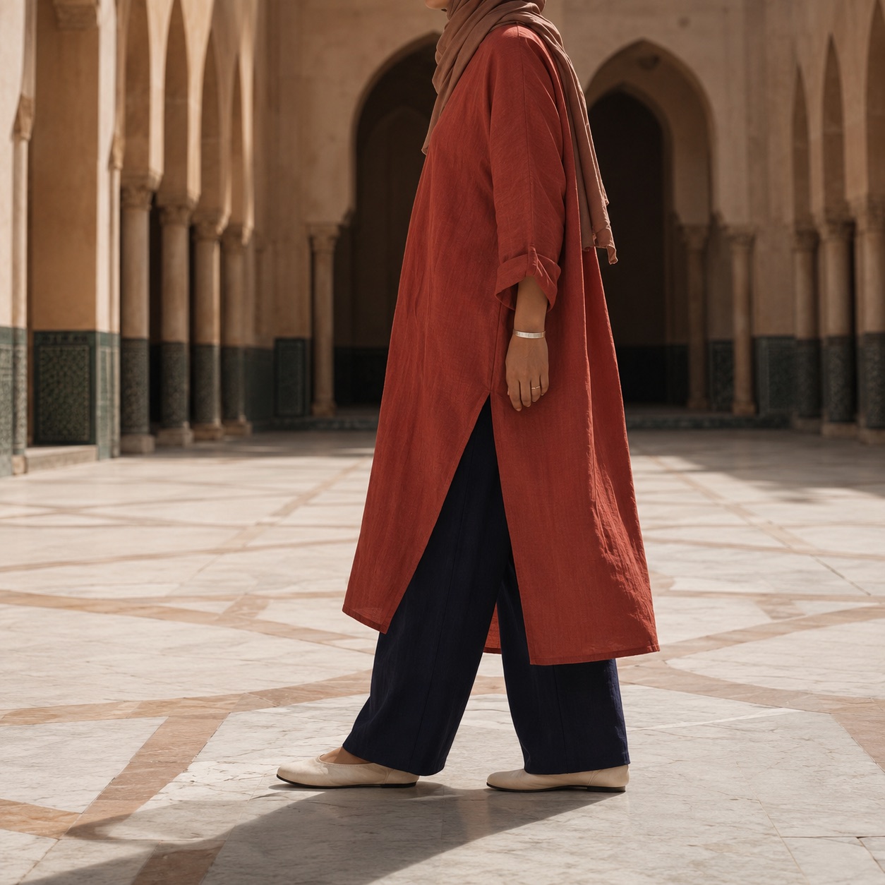 Orford longline tunic — Tunics & Overtops by RUQYAH. worn by a model, side view.
