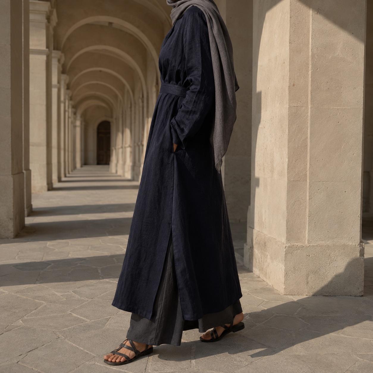 Rowanhill longline tunic — Tunics & Overtops by RUQYAH. worn by a model, side view.