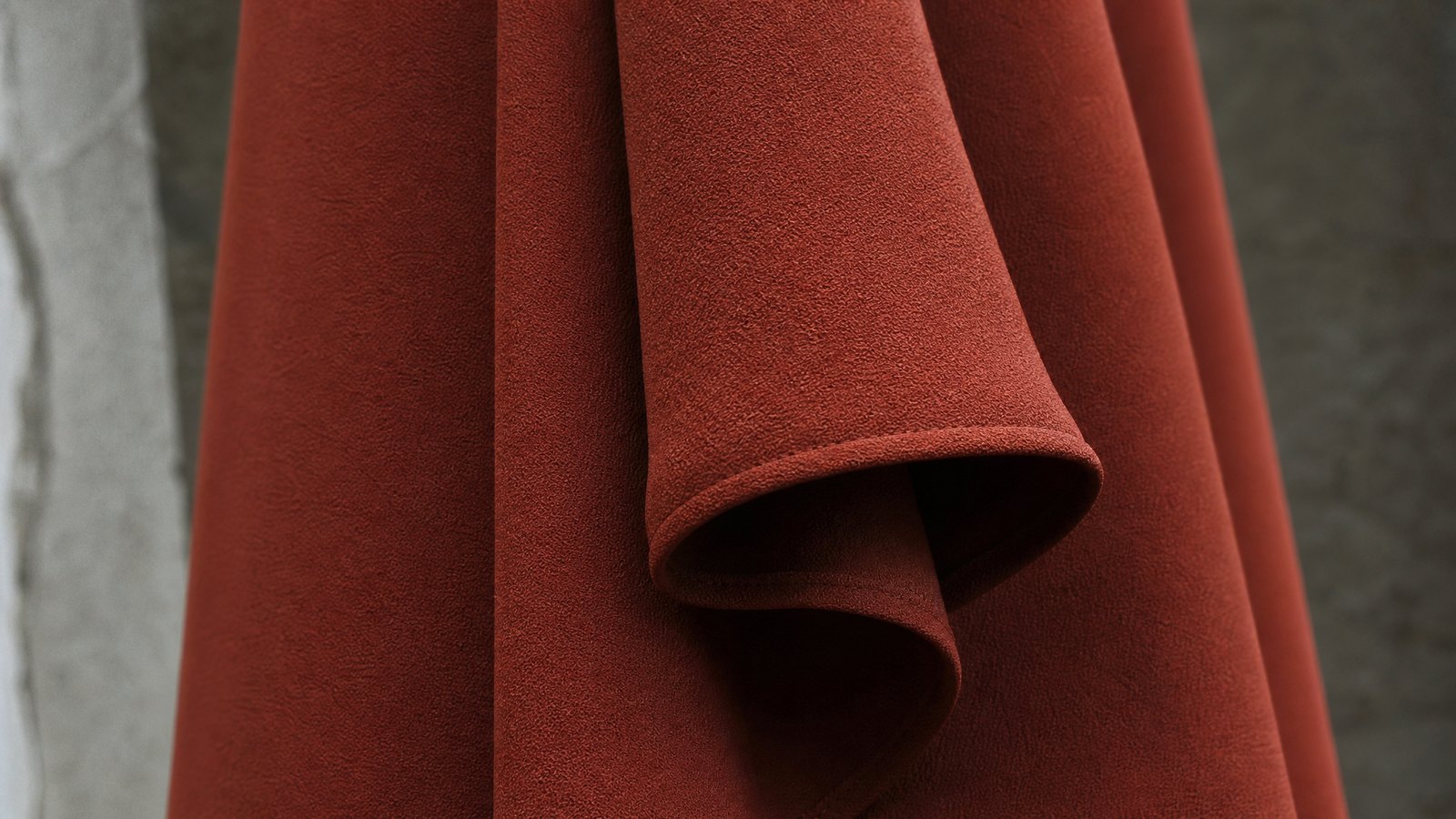 Close detail of overlapping charcoal ribbed and oatmeal cable knitted fabric