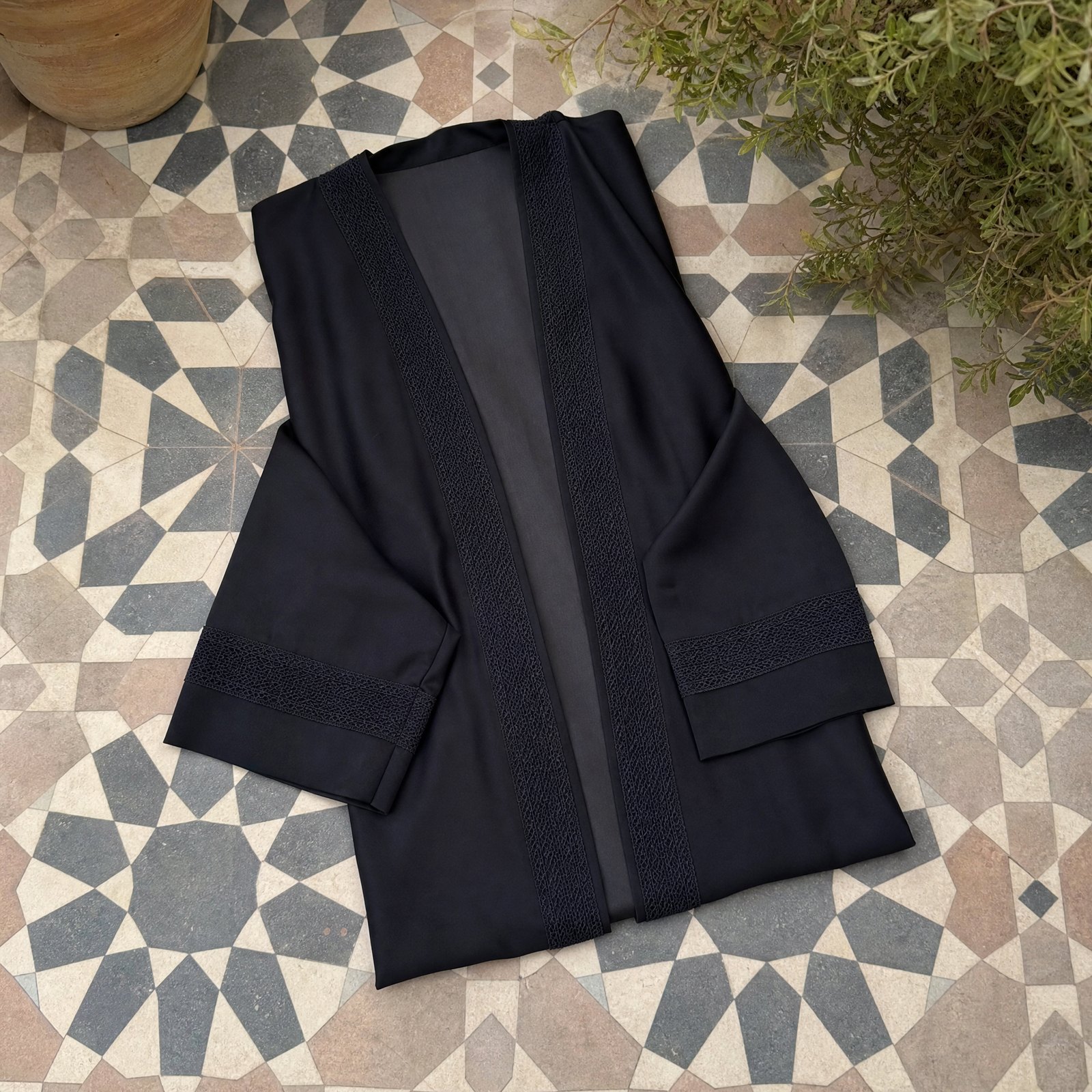Folded abayas robes from the RUQYAH range