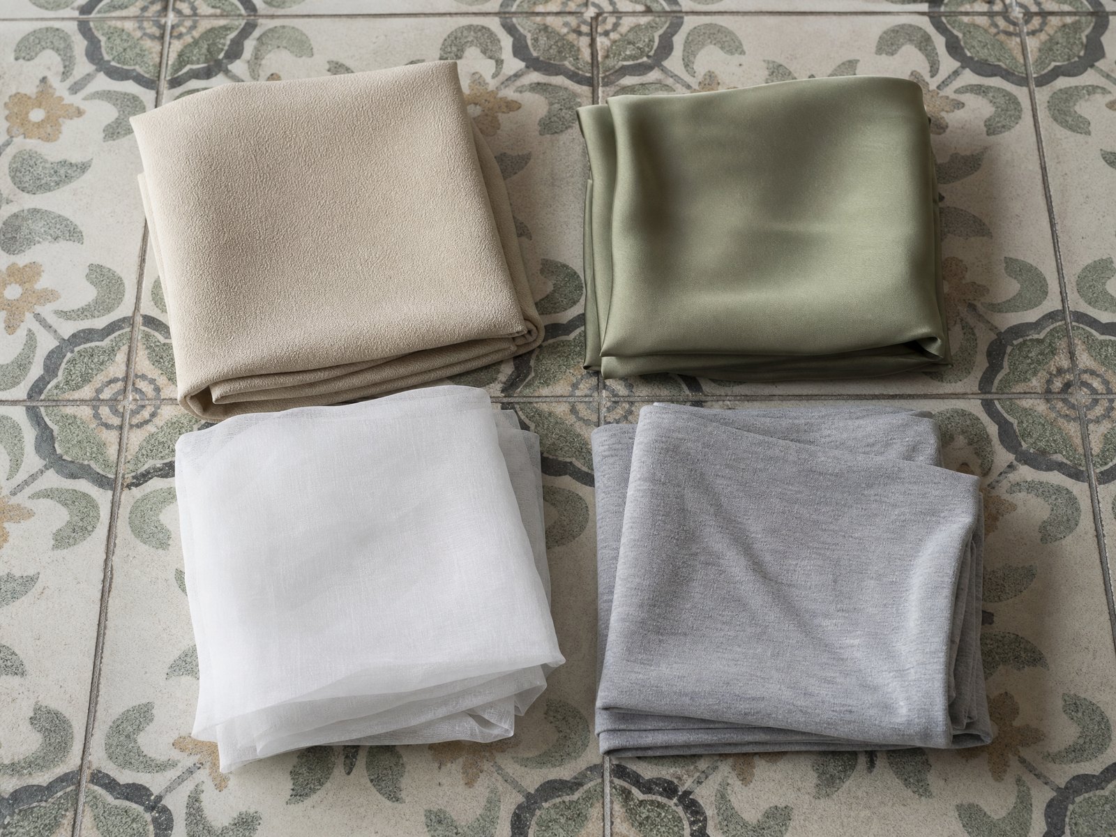 Four cones of yarn in merino, lambswool, cotton and bamboo viscose